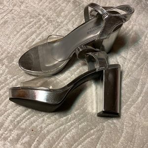 Silver shoes the heal is 4 inches I wore them one time.